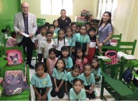 Archie with children inside the classroom at Palumlum elementary school 